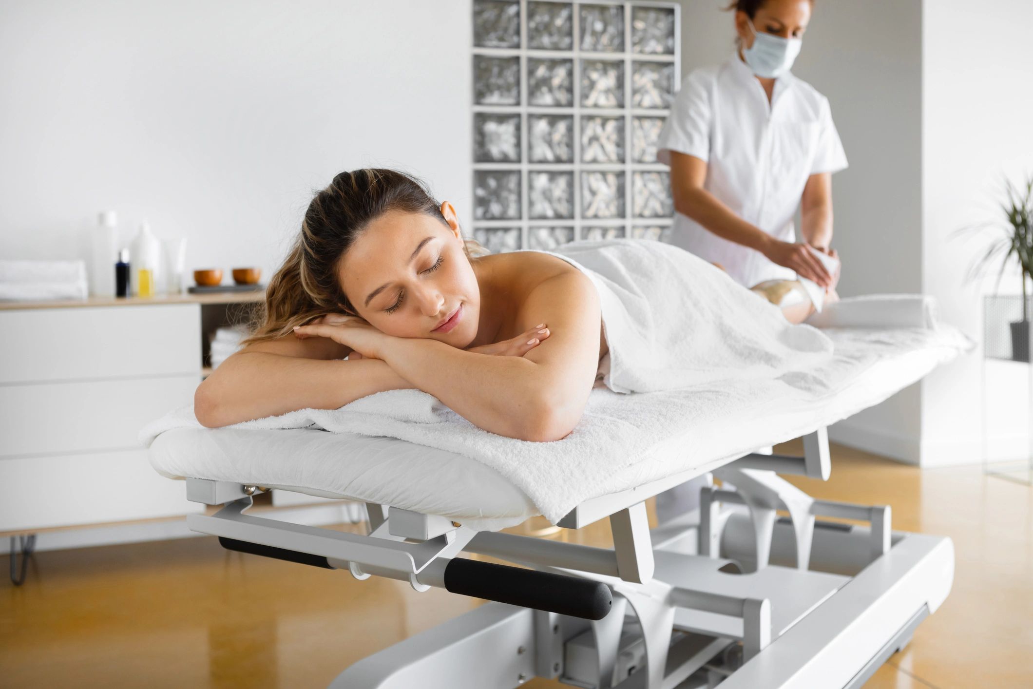 Guest relaxing during a spa massage treatment