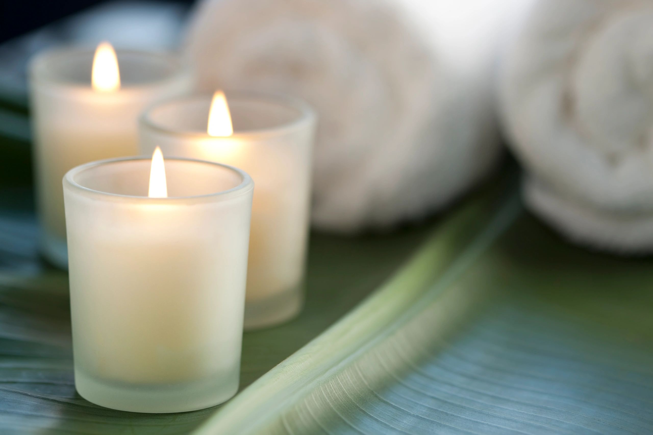 Candles and towels in a tranquil spa setting